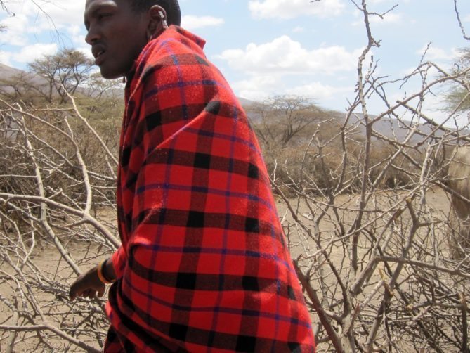 Maasai Women and men wear red blanket