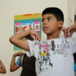 Syrian children learn yoga