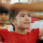 Syrian children learn yoga