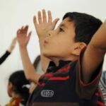 Syrian children learn yoga