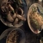 A variety of dishes on a table, ready to be served.